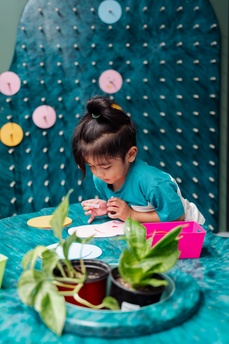 Child crafting at craft station