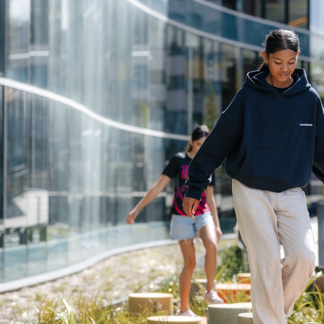 Kids walking on the stone blocks