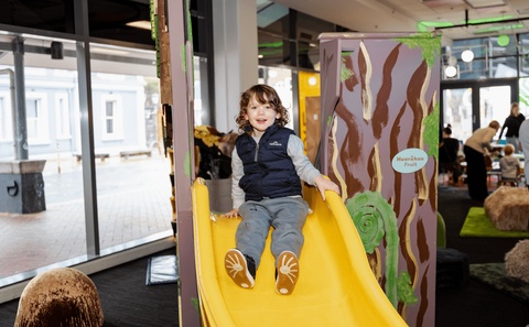 child on indoor slide