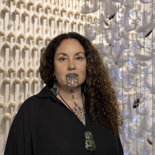 Lady artist in front of artwork