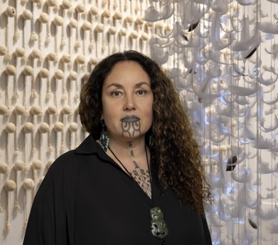 Lady artist in front of artwork